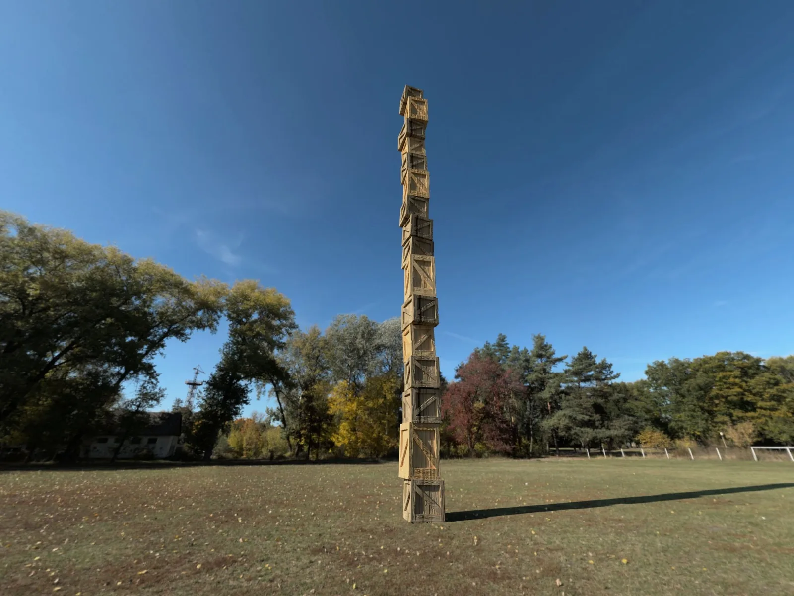 Rendering of a 40-foot tower of stacked crates in an open field